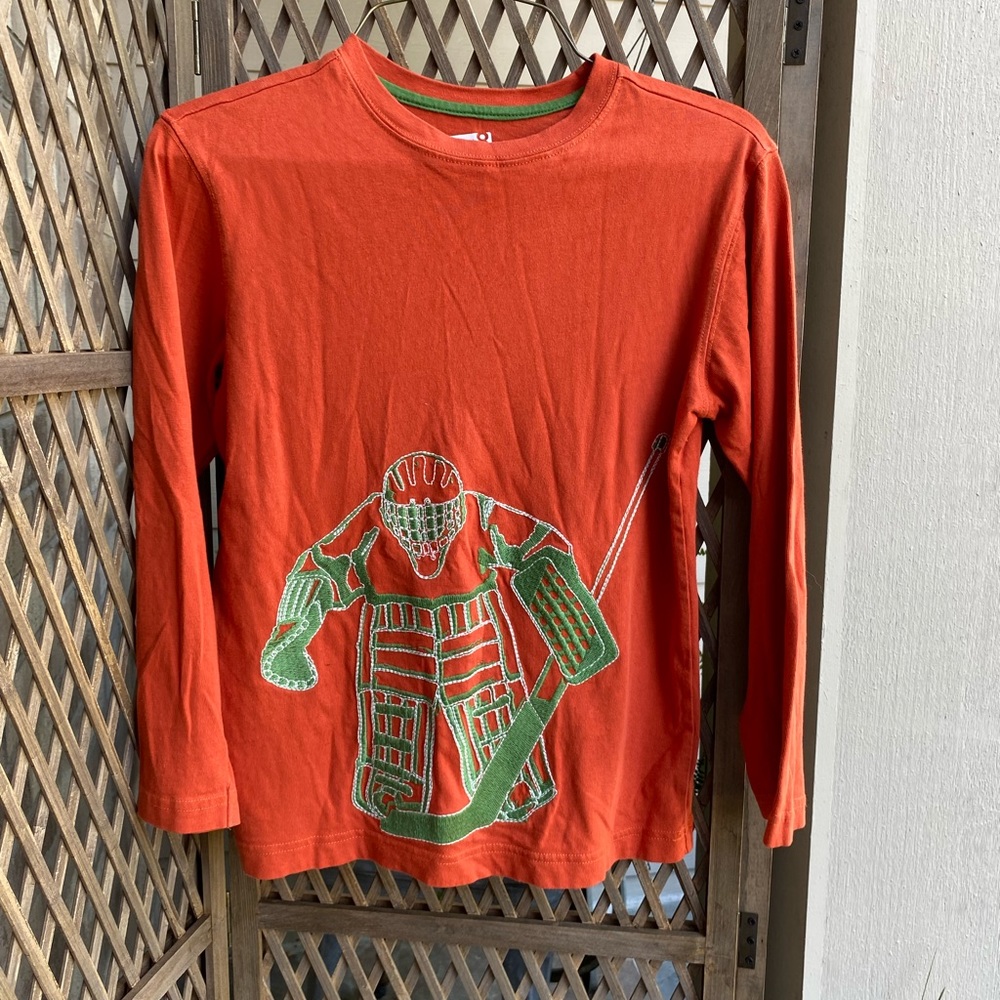 Embroidered goaltender T 4 your little hockey fan.